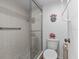 Bathroom featuring a shower, toilet, and updated vanity at 1814 Mariner Dr # 159, Tarpon Springs, FL 34689