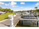 Wooden dock with multiple boats and seating providing waterfront access at 1814 Mariner Dr # 159, Tarpon Springs, FL 34689