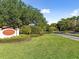 Entrance to Mariner Village Tarpon Cove community featuring landscaping at 1814 Mariner Dr # 159, Tarpon Springs, FL 34689