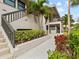 Condo building exterior showcasing entrance and landscaping at 1814 Mariner Dr # 159, Tarpon Springs, FL 34689