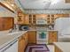 Condo kitchen with light wood cabinets and appliances at 1814 Mariner Dr # 159, Tarpon Springs, FL 34689