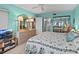Main bedroom with large bed, dresser, and lovely water views at 1814 Mariner Dr # 159, Tarpon Springs, FL 34689