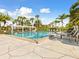 Refreshing swimming pool with pergola and lounge chairs at 1814 Mariner Dr # 159, Tarpon Springs, FL 34689