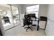 Home office with standing desk and patio view at 2870 Rampart Cir, Clearwater, FL 33761