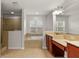 Spacious bathroom with double vanity, soaking tub, and shower at 4104 Warwick Hills Dr, Wesley Chapel, FL 33543
