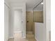 Bathroom with a large walk-in shower and tile flooring at 4104 Warwick Hills Dr, Wesley Chapel, FL 33543