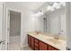 Bathroom with double vanity and a tub at 4104 Warwick Hills Dr, Wesley Chapel, FL 33543