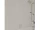 Bathroom features a shower/tub combo and tile surround at 4104 Warwick Hills Dr, Wesley Chapel, FL 33543