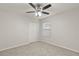 Bedroom with ceiling fan and window with blinds at 4104 Warwick Hills Dr, Wesley Chapel, FL 33543