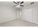 Bright bedroom featuring a ceiling fan and ample closet space at 4104 Warwick Hills Dr, Wesley Chapel, FL 33543