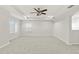 Spacious bedroom with ceiling fan and carpet flooring at 4104 Warwick Hills Dr, Wesley Chapel, FL 33543