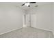 Simple bedroom with ceiling fan and carpet flooring at 4104 Warwick Hills Dr, Wesley Chapel, FL 33543