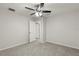 Spacious bedroom with ceiling fan and neutral wall colors at 4104 Warwick Hills Dr, Wesley Chapel, FL 33543