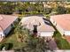 House with solar panels and a well-kept lawn at 5006 Ruby Flats Dr, Wimauma, FL 33598