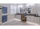 Elegant bathroom with double vanity and granite countertop at 5006 Ruby Flats Dr, Wimauma, FL 33598