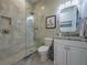 Clean bathroom with a shower and granite countertop at 5006 Ruby Flats Dr, Wimauma, FL 33598