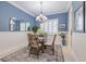 Casual dining area with a blue accent wall and natural light at 5006 Ruby Flats Dr, Wimauma, FL 33598
