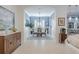 Elegant dining room with a chandelier and access to the kitchen at 5006 Ruby Flats Dr, Wimauma, FL 33598