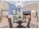 Bright dining room with a glass-top table and four chairs at 5006 Ruby Flats Dr, Wimauma, FL 33598