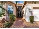 Front entry with double doors and a brick walkway at 5006 Ruby Flats Dr, Wimauma, FL 33598