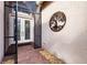 Front entry with double doors, screened porch, and brick pavers at 5006 Ruby Flats Dr, Wimauma, FL 33598