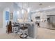 Kitchen with white cabinets, granite countertops, and breakfast bar with seating at 5006 Ruby Flats Dr, Wimauma, FL 33598