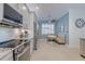 Spacious kitchen with stainless steel appliances and granite countertops at 5006 Ruby Flats Dr, Wimauma, FL 33598