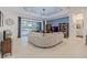 Open living area with large sectional sofa and pool view at 5006 Ruby Flats Dr, Wimauma, FL 33598