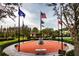 Memorial plaza with brick pavers, benches, and flags at 5006 Ruby Flats Dr, Wimauma, FL 33598