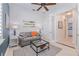 Bright home office features a sofa and plenty of natural light at 5006 Ruby Flats Dr, Wimauma, FL 33598