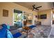 Covered patio with seating and view of pool and kitchen at 5006 Ruby Flats Dr, Wimauma, FL 33598