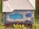 Aerial view of a kidney-shaped pool with a screened enclosure at 5006 Ruby Flats Dr, Wimauma, FL 33598