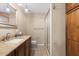 Bathroom with granite countertop, shower, and toilet at 6006 Soaring Ave, Temple Terrace, FL 33617