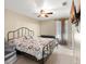 Primary bedroom with king-size bed and ceiling fan at 6006 Soaring Ave, Temple Terrace, FL 33617