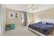 Spacious bedroom with a king-size bed and ceiling fan at 6006 Soaring Ave, Temple Terrace, FL 33617