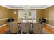 Elegant dining room with chandelier and hardwood floors at 6006 Soaring Ave, Temple Terrace, FL 33617