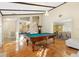 Spacious game room with pool table and hardwood floors at 6006 Soaring Ave, Temple Terrace, FL 33617