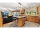 Kitchen with island, granite countertops, and stainless steel appliances at 6006 Soaring Ave, Temple Terrace, FL 33617