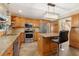 Spacious kitchen with granite countertops and island at 6006 Soaring Ave, Temple Terrace, FL 33617
