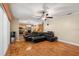 Spacious living room featuring hardwood floors and a comfortable sectional sofa at 6006 Soaring Ave, Temple Terrace, FL 33617