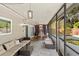Spacious screened-in porch with seating and dining area at 6006 Soaring Ave, Temple Terrace, FL 33617