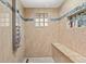 Large walk-in shower with multiple shower heads at 6006 Soaring Ave, Temple Terrace, FL 33617