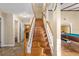 Elegant wooden staircase leading to the upper level at 6006 Soaring Ave, Temple Terrace, FL 33617