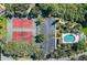 Two tennis courts and community pool, aerial view at 6232 Bayside Key Dr, Tampa, FL 33615