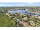 Aerial view of waterfront community with tennis courts and pool at 6232 Bayside Key Dr, Tampa, FL 33615
