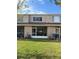 Spacious backyard with green grass and townhome at 6232 Bayside Key Dr, Tampa, FL 33615
