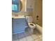 Clean bathroom with gray vanity, white toilet and bathtub at 6232 Bayside Key Dr, Tampa, FL 33615