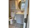 Bathroom with gray vanity and a white toilet at 6232 Bayside Key Dr, Tampa, FL 33615
