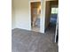 Carpeted bedroom with bathroom access, offering a blend of comfort and convenience in a single space at 6232 Bayside Key Dr, Tampa, FL 33615