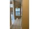 Bright hallway with tile floors and view into living room at 6232 Bayside Key Dr, Tampa, FL 33615